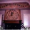 Faux finish, aged background hand painted olive branch and wrought iron grill, private residence